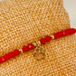 ZO3015 Pulsera Roja Cristales Checos y bolitas Diferentes Figuras Baño Oro